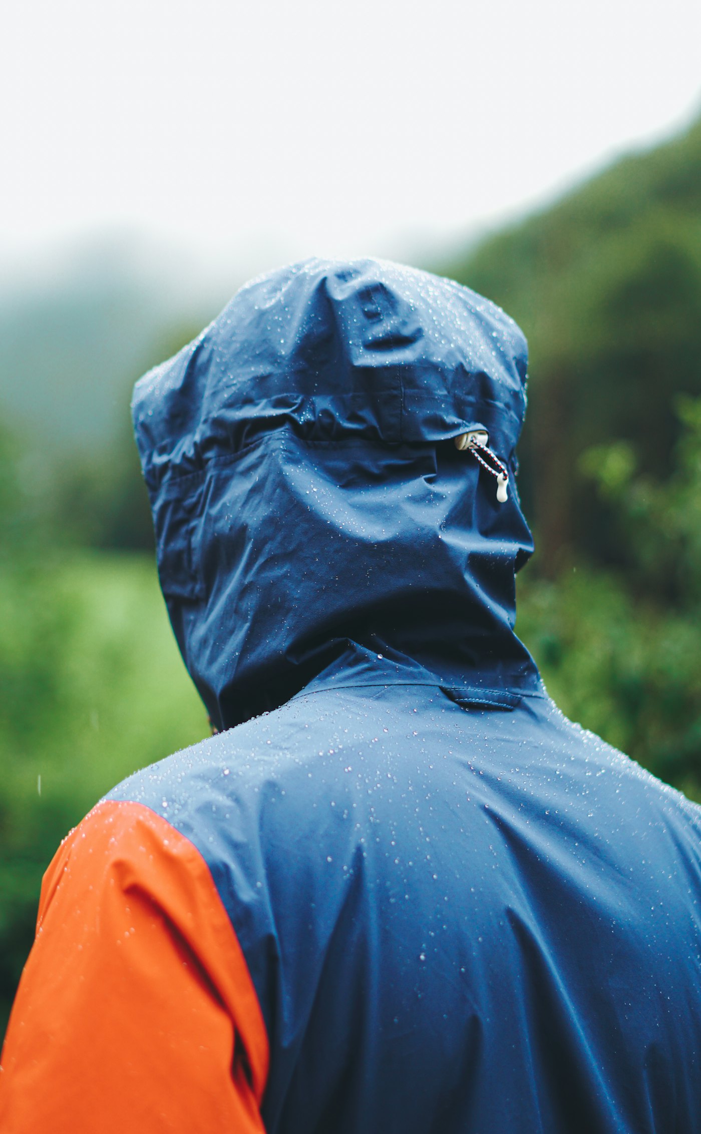 Waterproof outdoor shell jacket with water beading on the hood